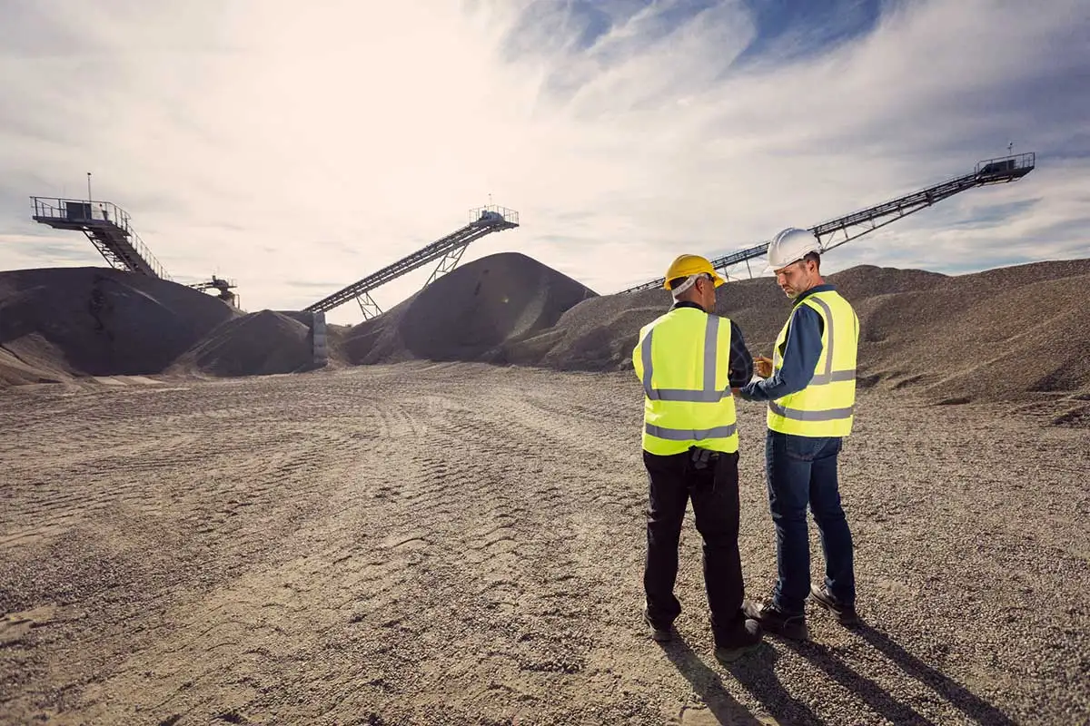 View of open pit mine with workers